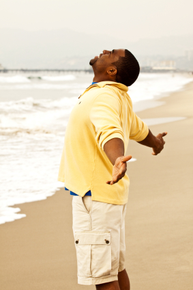 Black Man on Beach with Open Arms